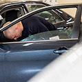 Auto glass technician installing a side window